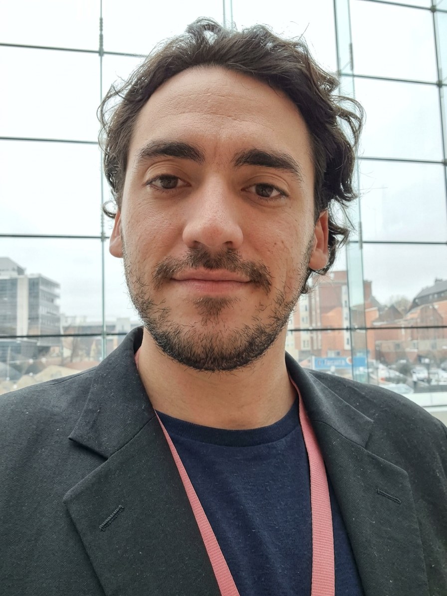 Kyle White's selfie at the 2019 CMU summit in Pittsburgh, wearing a lanyard