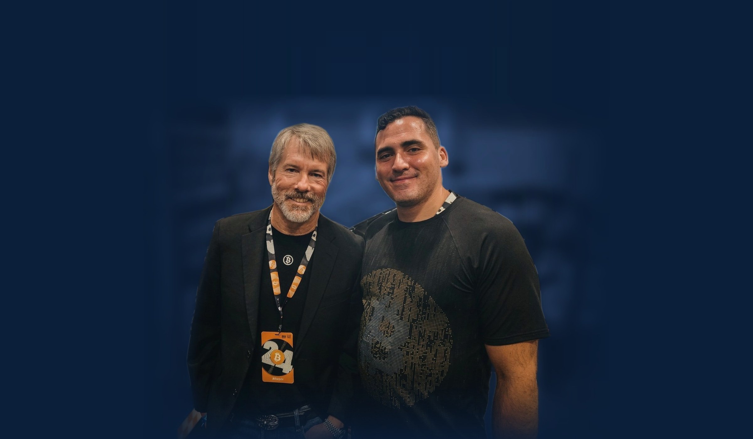 Kyle White in a black tee standing beside Michael Saylor at the Bitcoin 2024 conference in Nashville